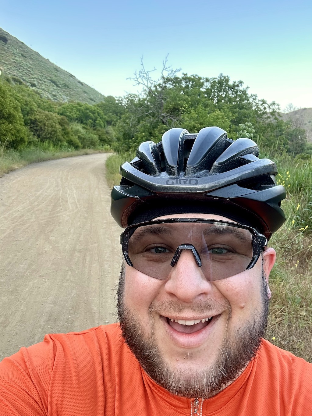selfie of author grinning on a gravel road