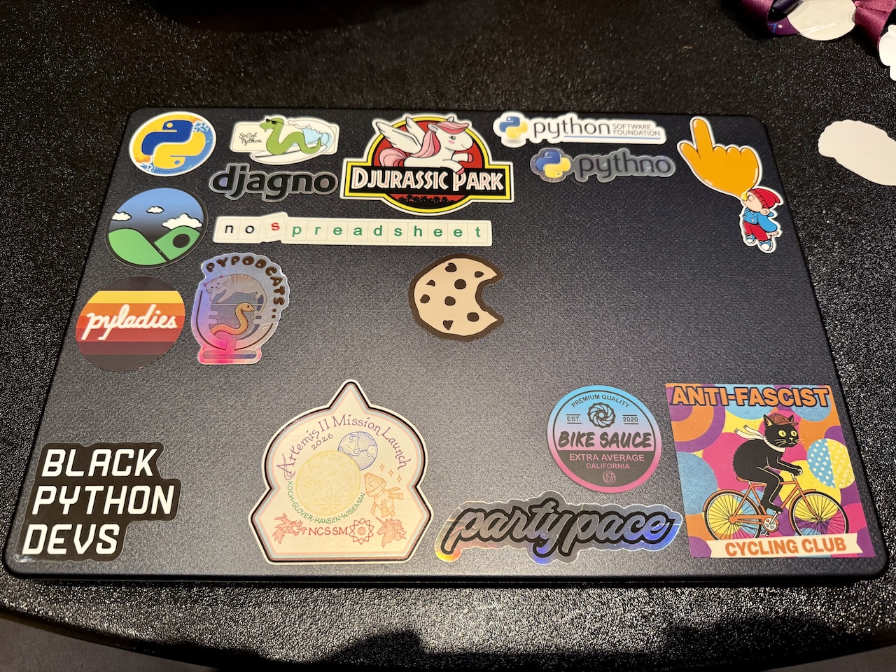 whole bunch of Python and cycling themed stickers on a laptop case whole bunch of Python and cycling themed stickers on a laptop case